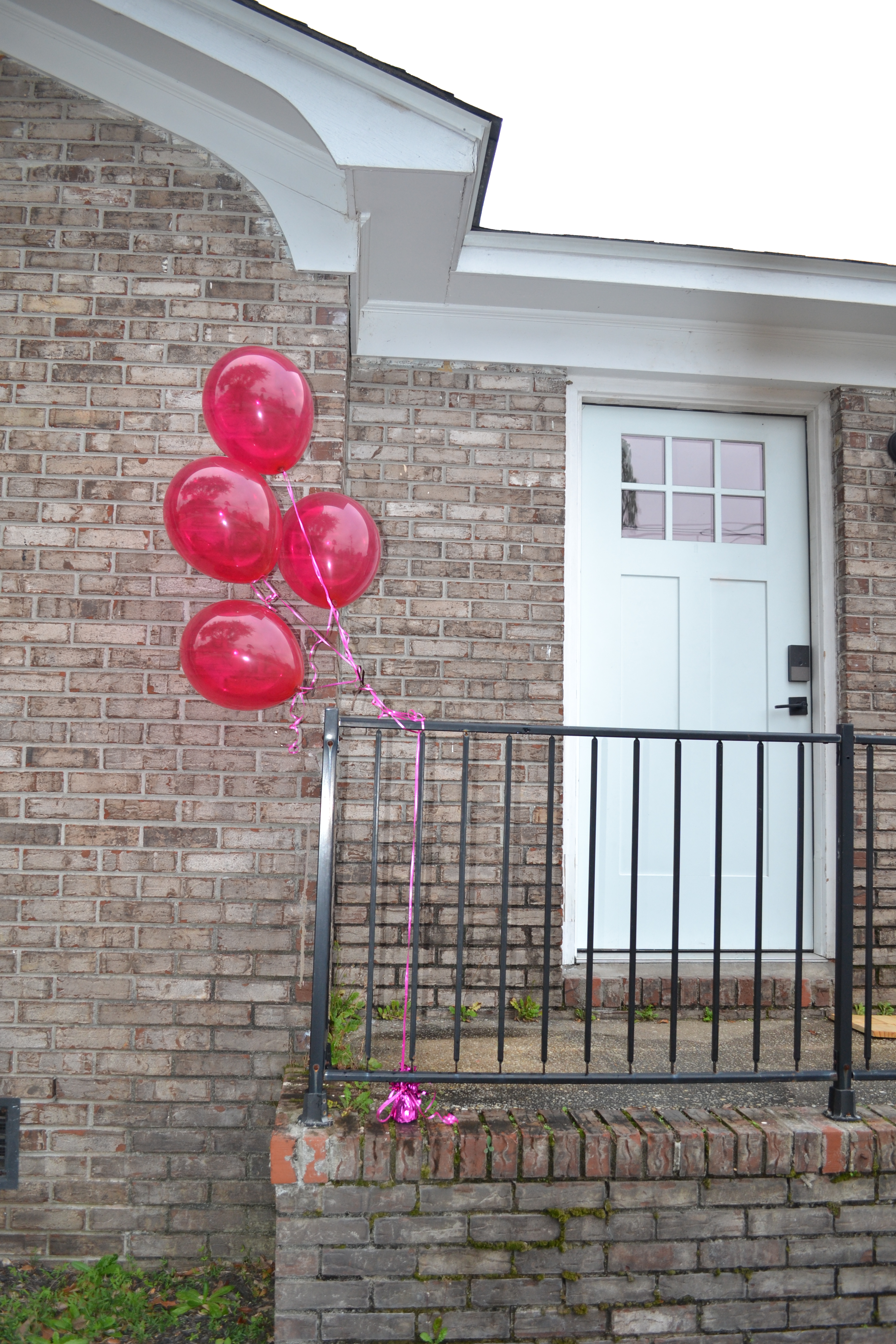 front house with balloons