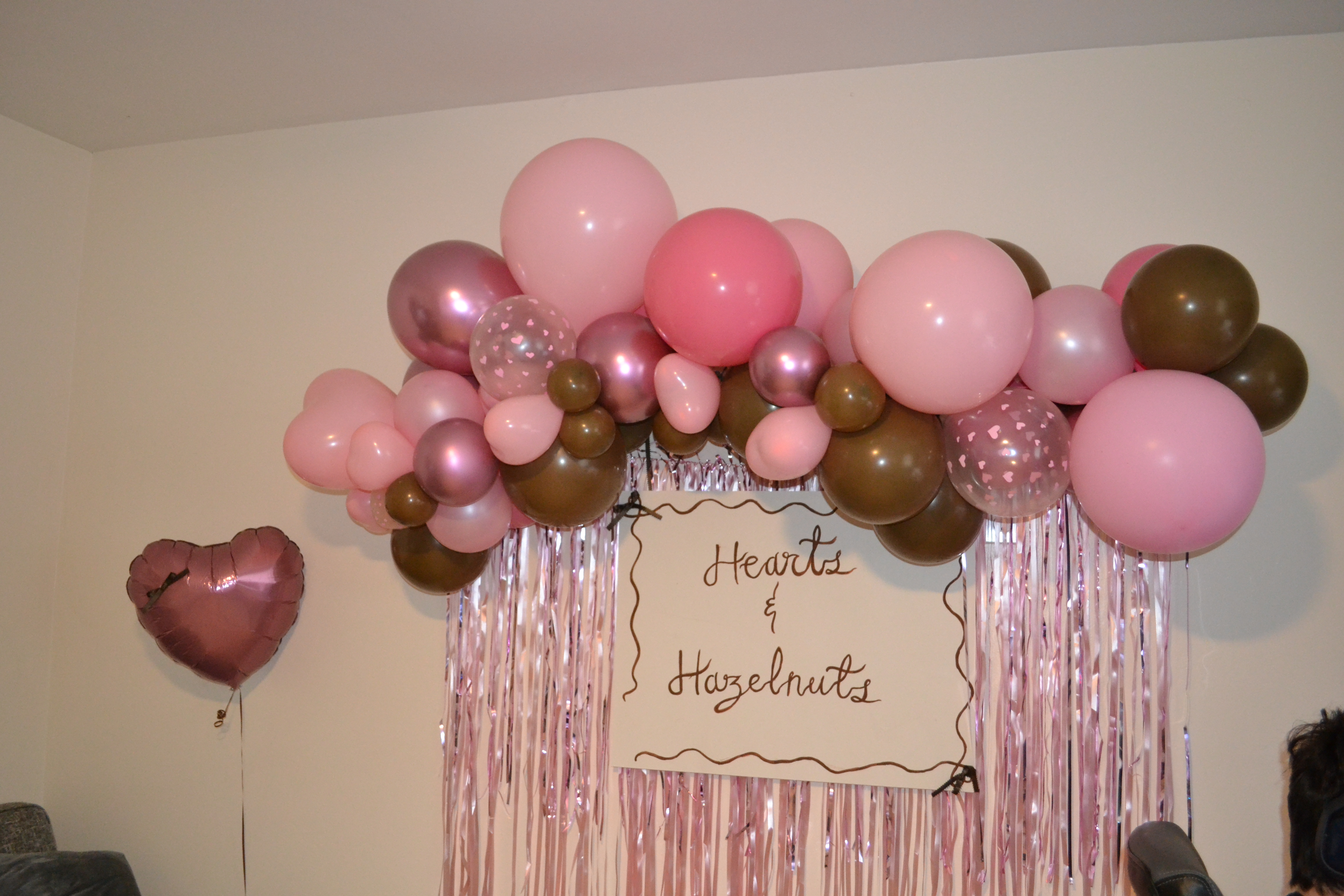 balloon garland backdrop for hearts and hazelnuts themed party
